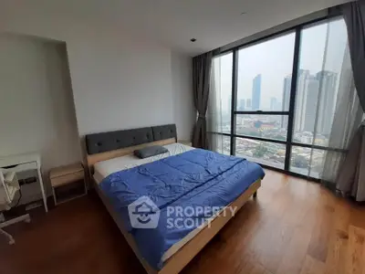 Spacious bedroom with stunning city view and modern furnishings