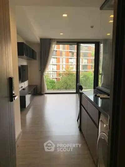 Modern apartment interior with open layout and balcony view