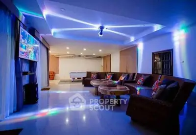 Luxurious living room with modern lighting and entertainment area