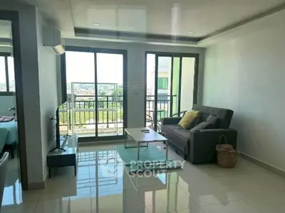 Modern living room with balcony view and sleek furnishings