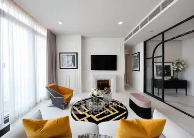Luxurious modern living room with stylish decor and large windows