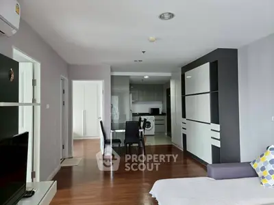 Spacious modern living room with open kitchen and dining area