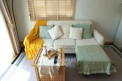 Cozy living room with stylish decor and natural light