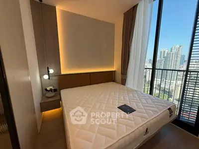 Modern bedroom with city view, featuring a large window and stylish lighting.