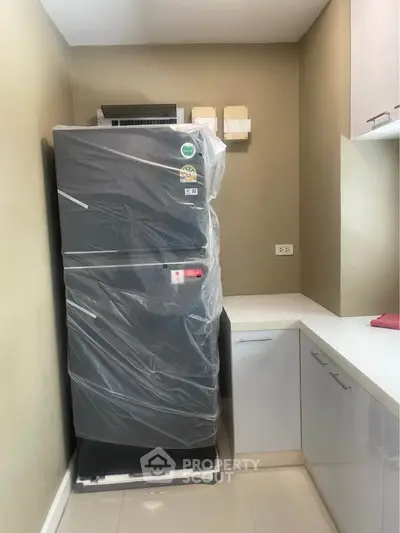 Modern kitchen with new refrigerator and sleek cabinetry