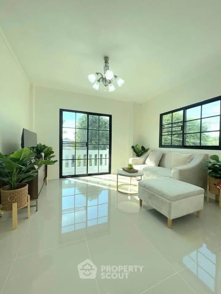 Bright and airy living room with modern decor and large windows