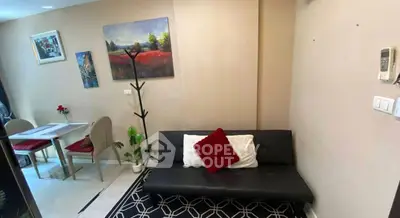 Cozy living room with modern decor and dining area, perfect for urban living.