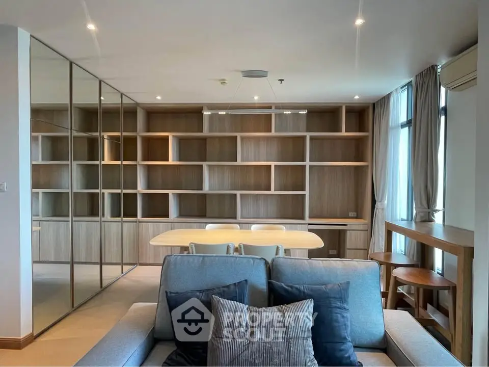 Modern living room with stylish shelving and cozy seating area