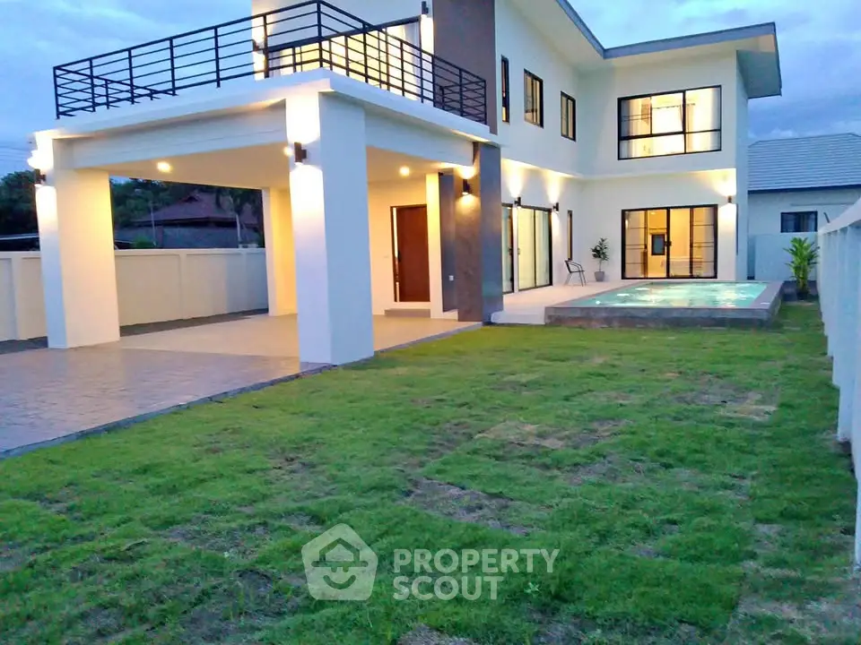 Luxurious modern two-story house with pool and spacious garden, perfect for family living.