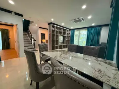 Spacious modern living room with elegant dining area and stylish decor