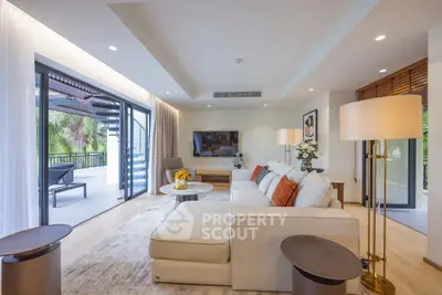 Luxurious living room with modern decor and spacious balcony access