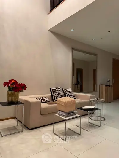 Modern living room with elegant beige sofa and stylish decor