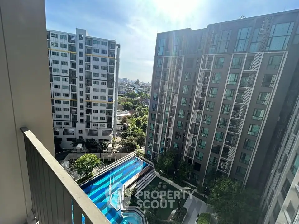 Stunning high-rise apartment view with pool and cityscape