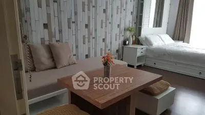 Chic studio apartment with modern decor and cozy furnishings, perfect for urban living.