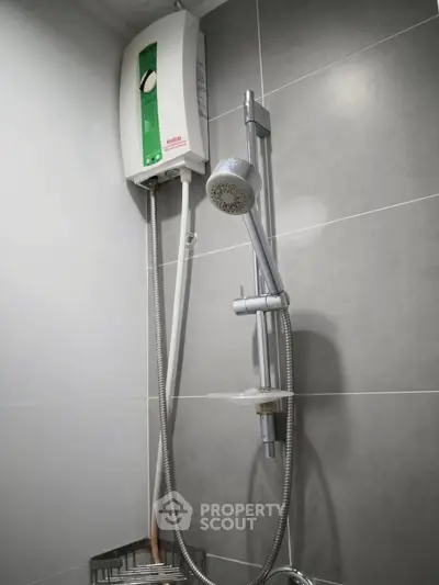 Modern bathroom with sleek shower and water heater in contemporary design.