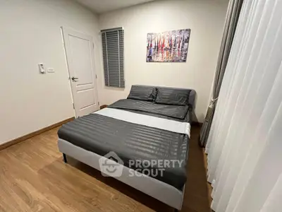 Cozy bedroom with modern decor and wooden flooring