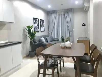 Modern open-layout living room with dining area and stylish decor
