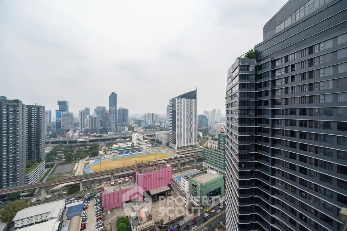 Stunning cityscape view from high-rise building with modern architecture and vibrant urban landscape.