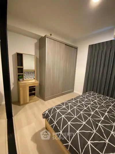 Modern bedroom with stylish decor and ample storage space
