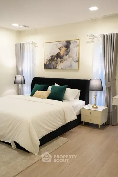 Luxurious bedroom with elegant decor and plush bedding in modern home