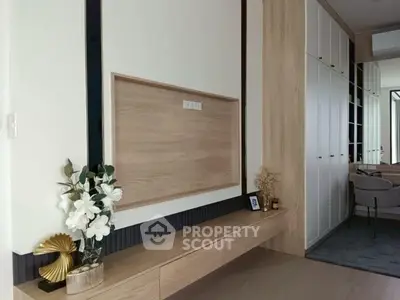 Modern interior with built-in storage and elegant decor in a stylish living space.