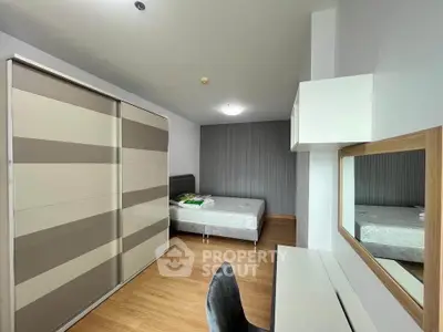 Modern bedroom with sleek wardrobe and stylish decor