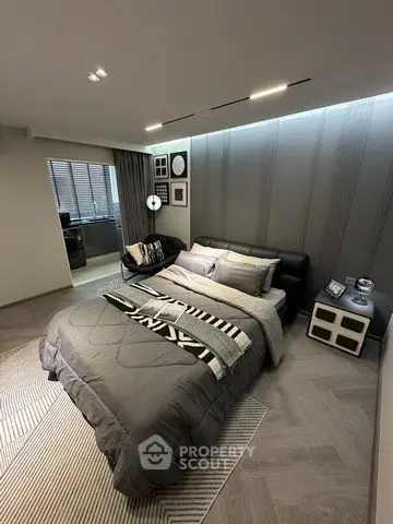 Modern bedroom with stylish decor and cozy ambiance, featuring a comfortable bed and elegant lighting.