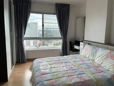 Bright bedroom with city view and colorful bedding in modern apartment