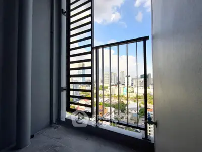 Stunning city view from a modern apartment balcony with sleek railing design.