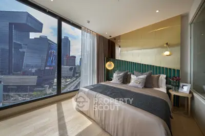 Luxurious bedroom with floor-to-ceiling windows offering stunning city views in modern high-rise apartment.