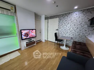 Modern living room with stylish wallpaper and cozy furniture