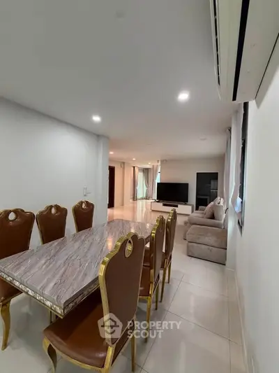 Spacious living room with elegant dining area and modern furnishings