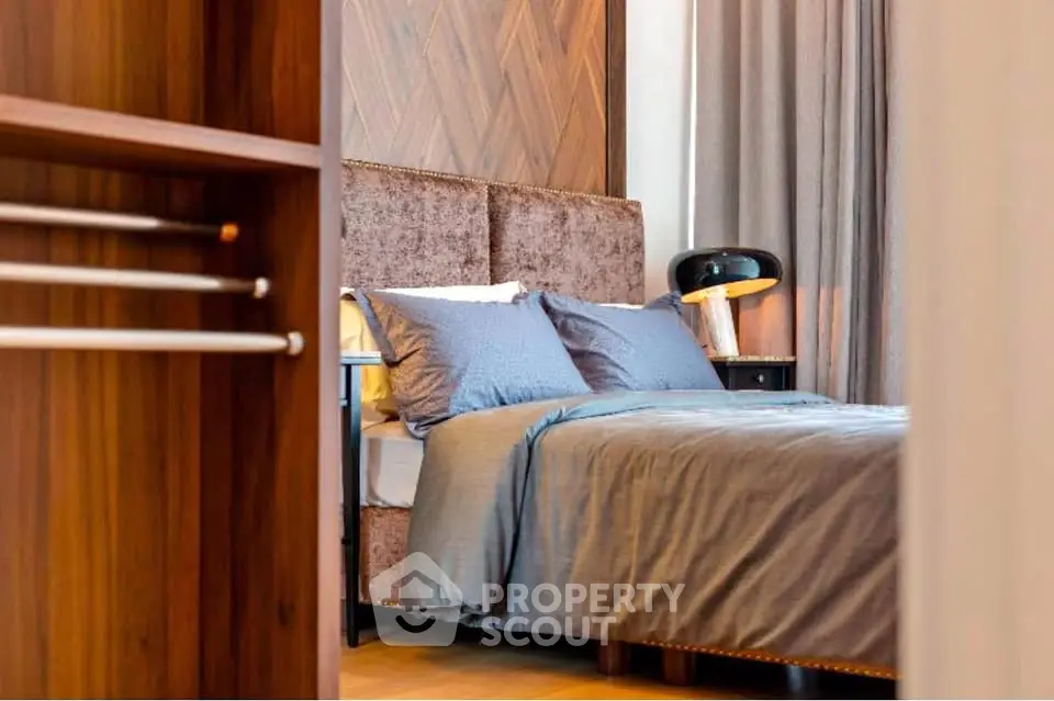 Luxurious bedroom with plush bedding and elegant wooden accents
