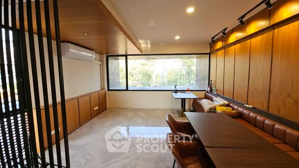 Modern living room with large windows and stylish furniture