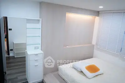 Cozy minimalist bedroom with modern design and soft lighting, perfect for relaxation and comfort.