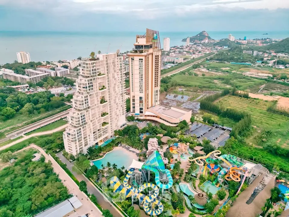 Luxurious beachfront resort with stunning architecture and water park amenities, offering breathtaking ocean views.