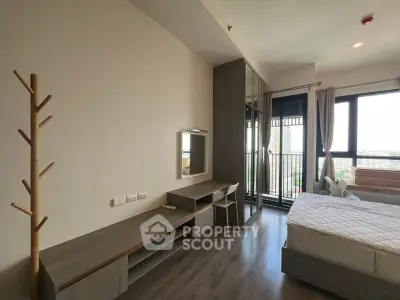Modern bedroom with balcony view in high-rise apartment