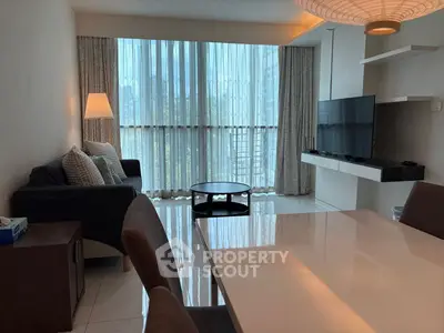 Modern living room with large windows and stylish furniture