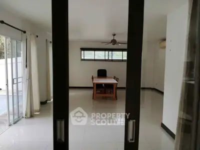 Spacious dining area with sliding glass doors and natural light