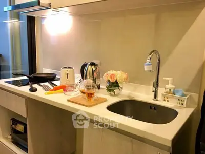 Modern kitchen with sleek countertop and appliances, perfect for culinary enthusiasts.