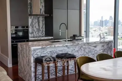 Luxurious modern kitchen with marble island and stunning city view, perfect for urban living.