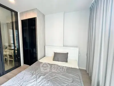 Modern bedroom with sleek design and large window for natural light