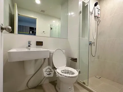Modern bathroom with glass shower and sleek fixtures