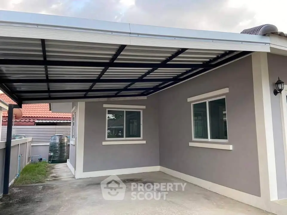 Modern single-story home with covered carport and sleek exterior design.