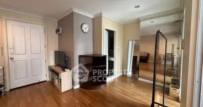 Spacious living room with wooden flooring and modern decor