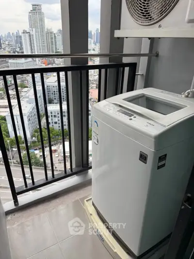 High-rise balcony with washing machine and stunning city view