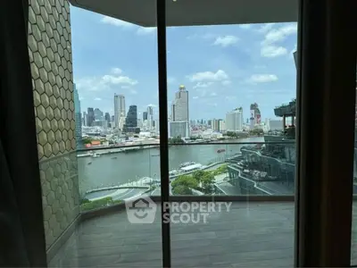 Stunning cityscape view from modern balcony overlooking river and skyline.
