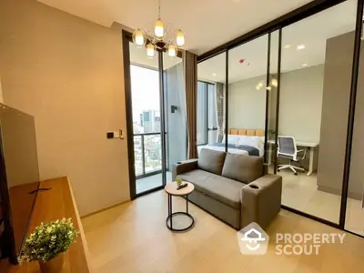 Modern apartment interior with cozy living room and bedroom, featuring glass partition and city view balcony.