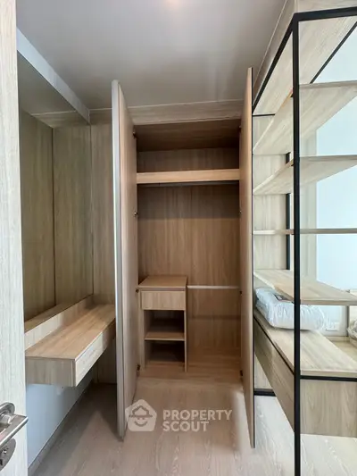 Spacious modern walk-in closet with wooden shelves and ample storage space.