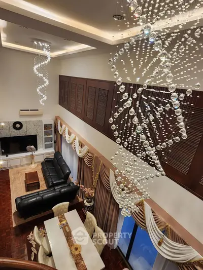 Luxurious living room with elegant chandeliers and stylish decor